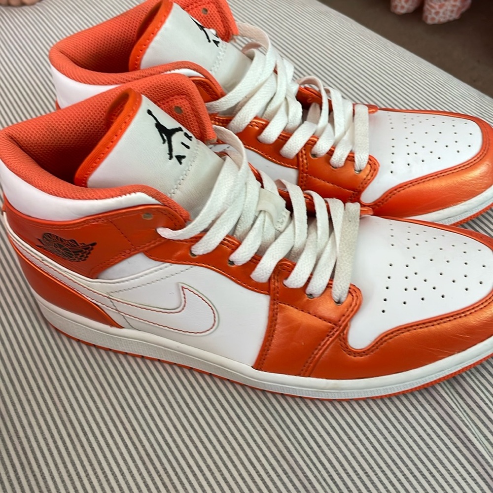 Metallic orange Jordan 1s. Mid. Women